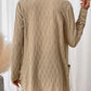 Textured beige cable knit cardigan, perfect for casual or dressy occasions, styled with a simple white tank.