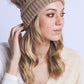 Unisex tan braided beanie with classic cable pattern

