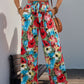 Tie-waist floral pants featuring bright floral pattern and pockets
