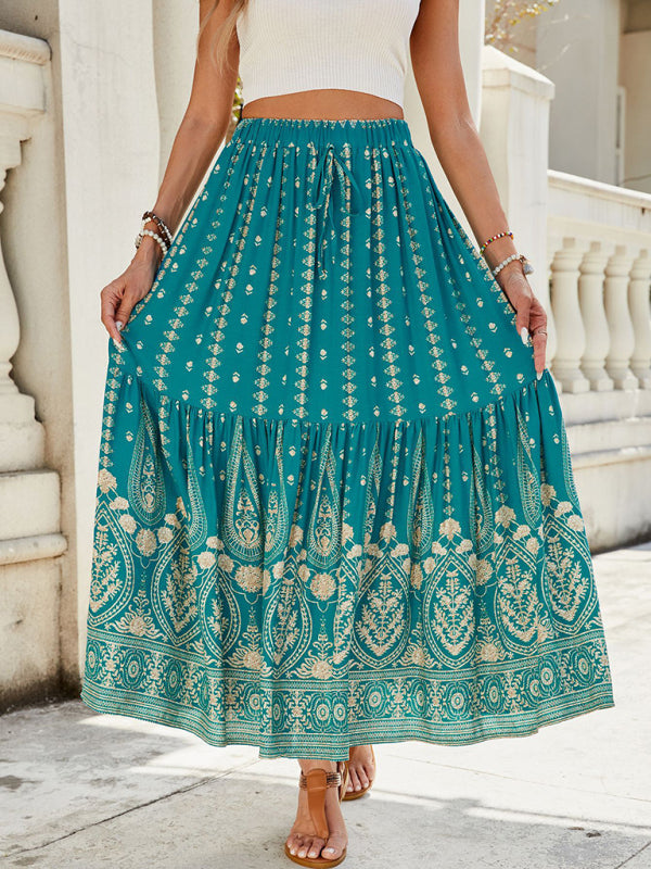 Tiered green skirt with bohemian print and flowing fit.