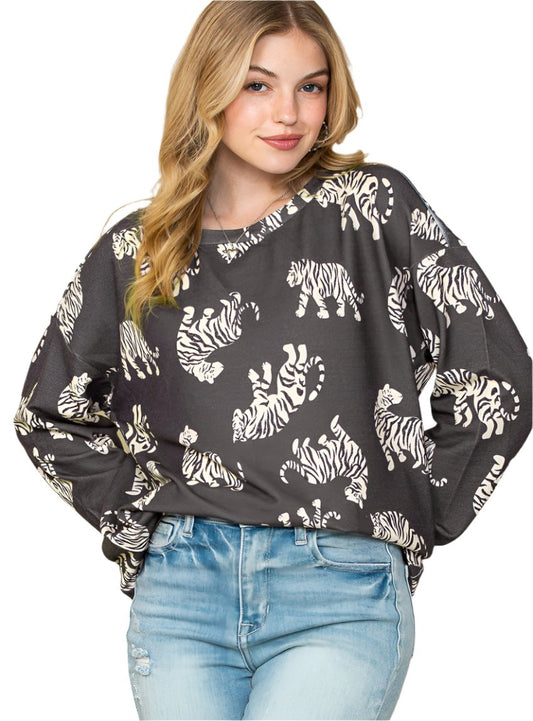 Woman wearing a tiger sweatshirt with all-over print
