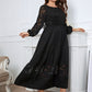 Black dress with lace neckline, perfect for evening wear.
