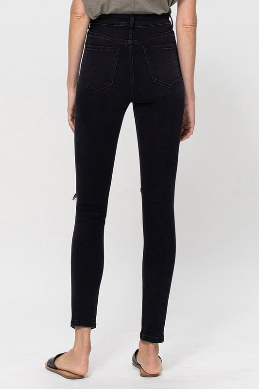 Black high-rise skinny jeans with distressed knees for women
