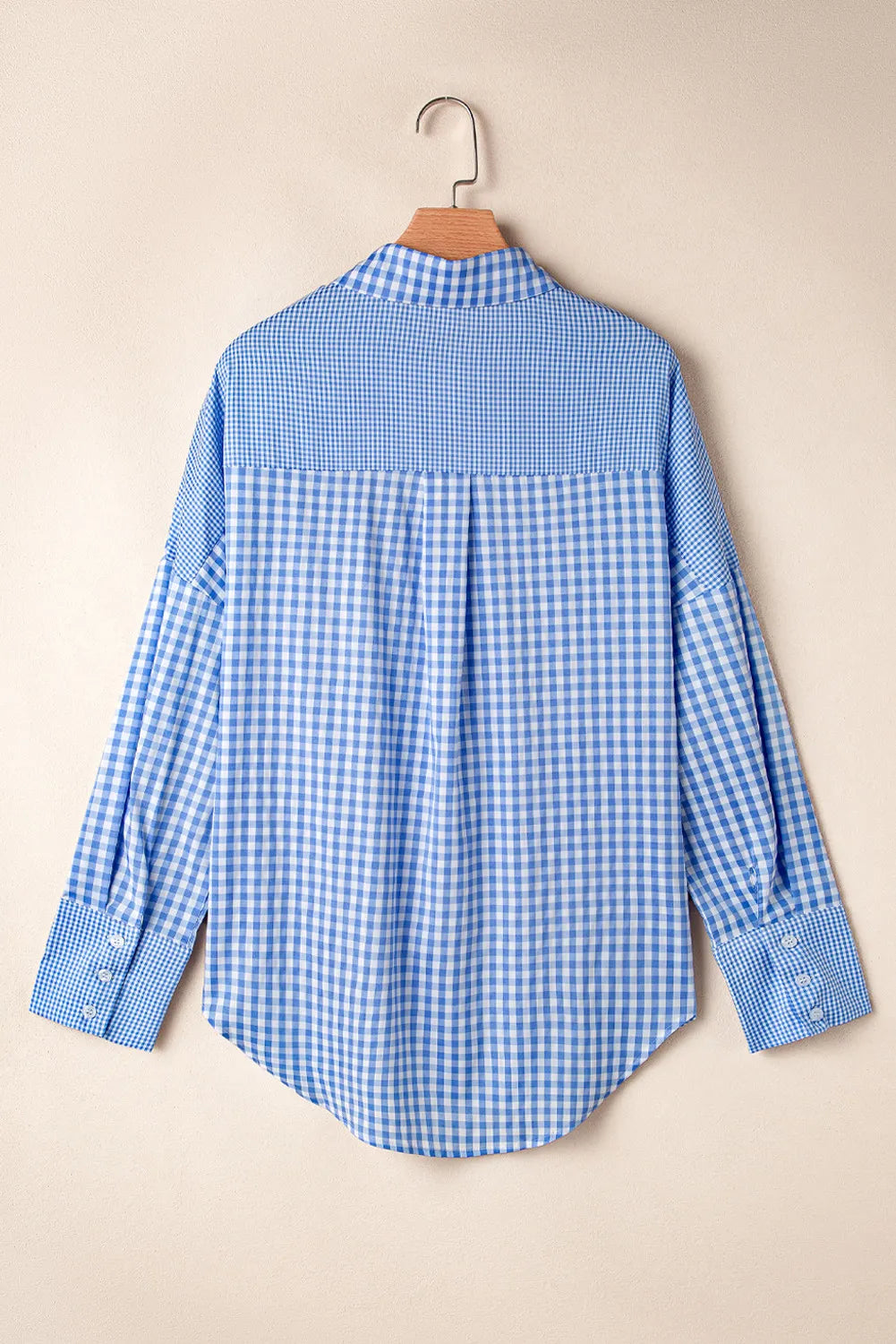 Lightweight blue gingham shirt styled for a casual weekend look
