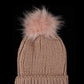 Blush knit cuffed winter hat with playful pom-pom detail.
