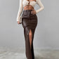 Brown high-waisted PU leather skirt with a sleek front slit.
