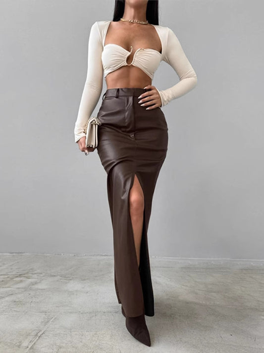 Brown high-waisted PU leather skirt with a sleek front slit.
