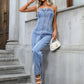 Casual outfit styled with spaghetti strap denim overalls and white heels.
