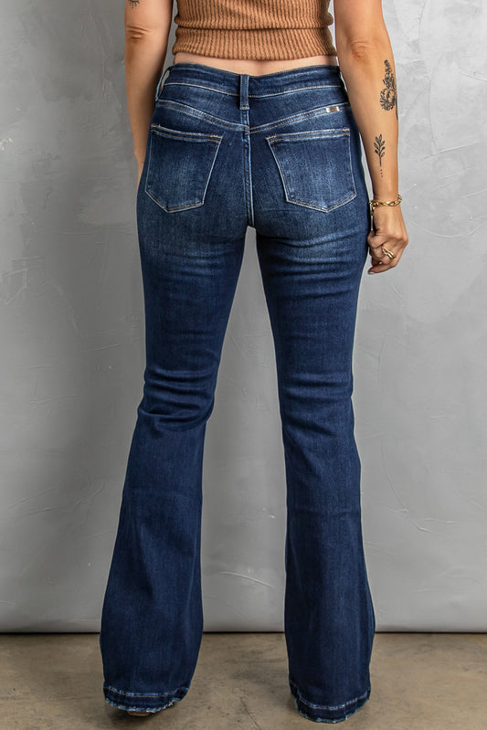 High-quality denim bootcut jeans with distressed finish.