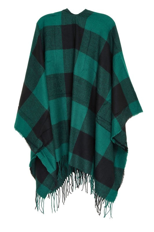 Cozy green plaid poncho, perfect for layering in fall
