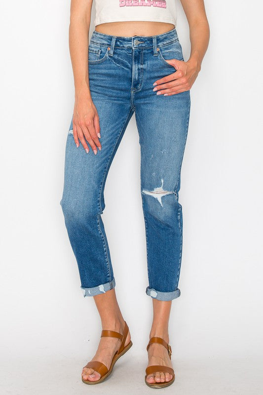 Trendy high-rise tapered jeans in plus size, featuring light distressing.
