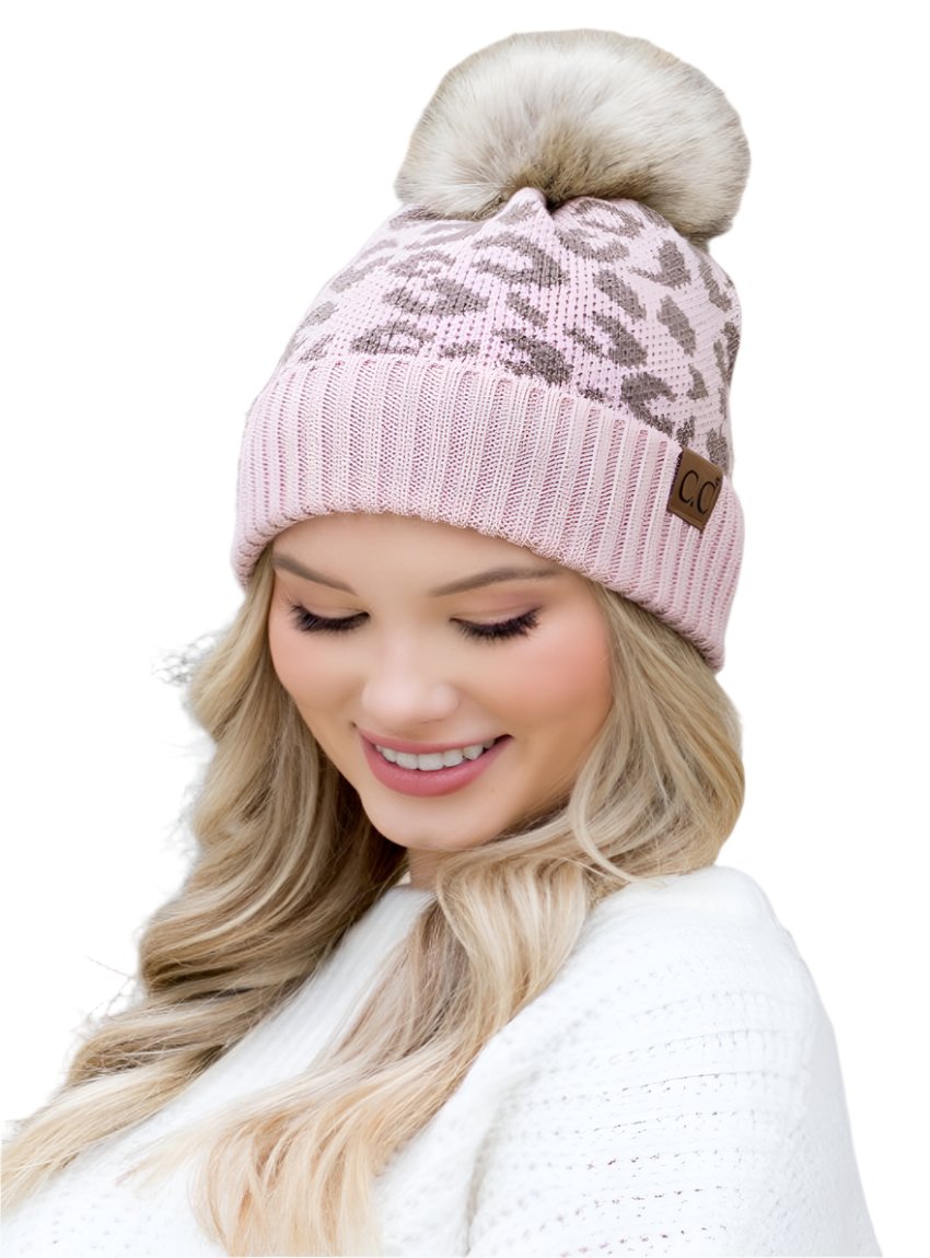 Pink CC beanie with natural leopard pattern and faux fur pom for a trendy touch
