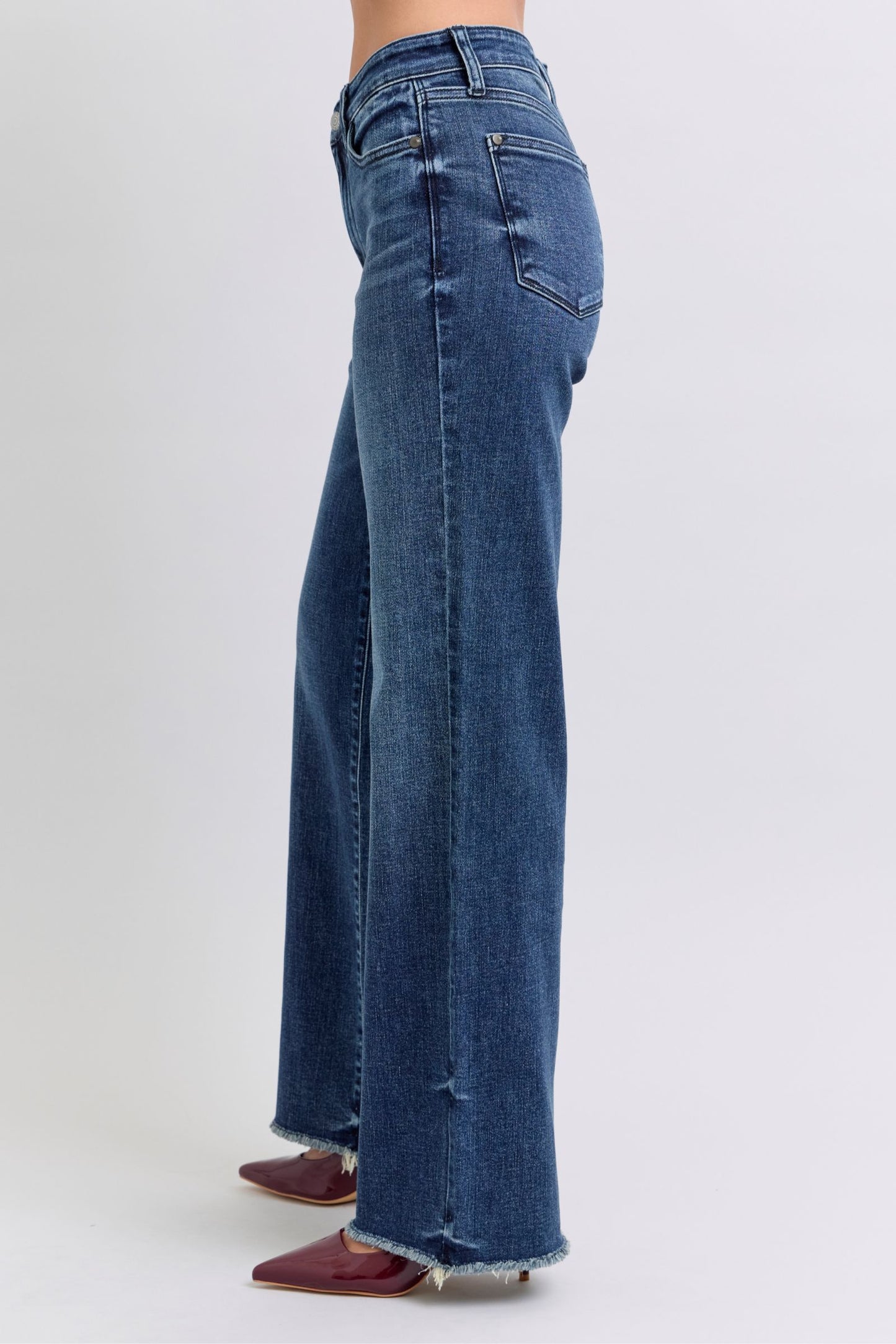 Trendy mid-rise jeans featuring edgy raw hem detail
