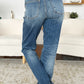 Judy Blue medium wash jeans with a mid-rise fit and release hem detail.
