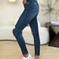 Women’s comfortable mid-waist slim-fit jeans with distressing.
