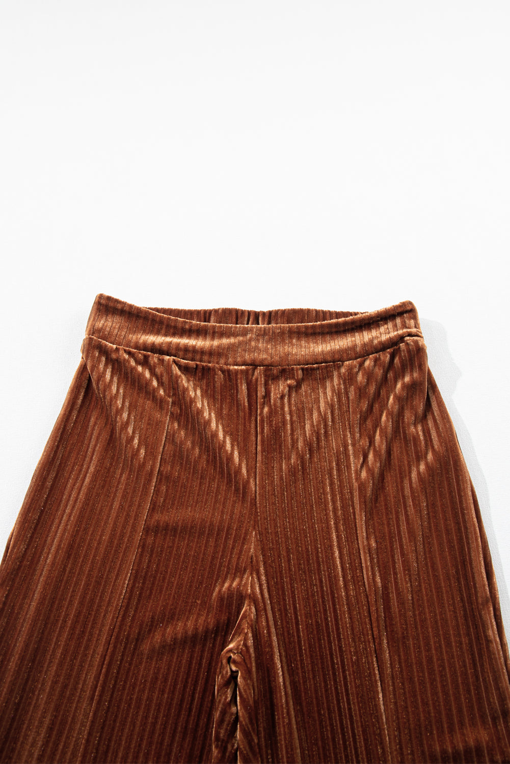 Trendy mocha flare pants with a high-waist design to elongate the legs.
