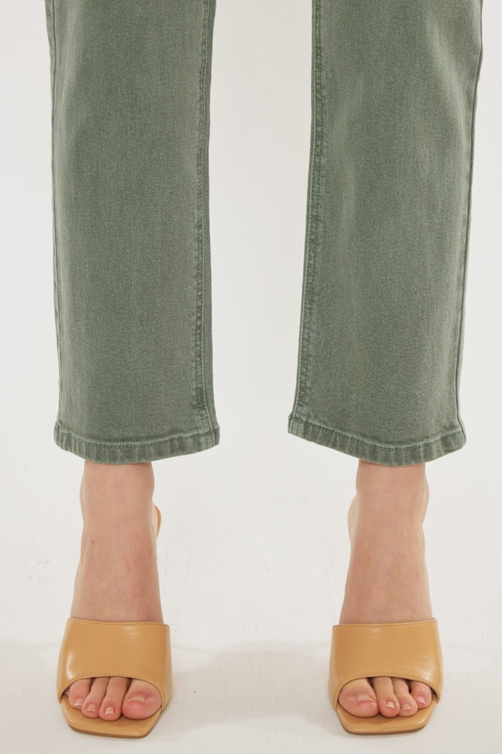 Women's olive jeans with a high waist and straight cut, perfect for casual wear.
