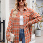 Lightweight orange plaid shirt styled with gold accessories for fall.
