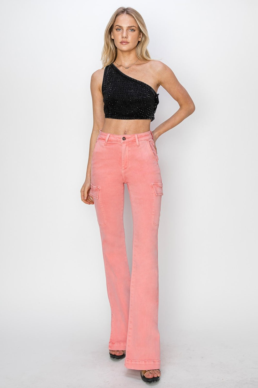 Trendy pink cargo jeans with a bootcut style, front view