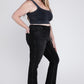 Edgy frayed hem on black plus-size crop flare jeans with cropped length.
