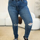 Front view of ripped slim-fit denim styled casually.
