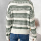 Trendy sage green and white striped sweater for women.
