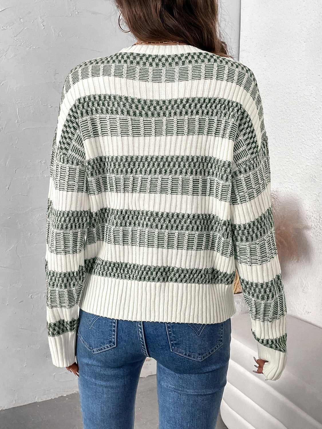 Trendy sage green and white striped sweater for women.
