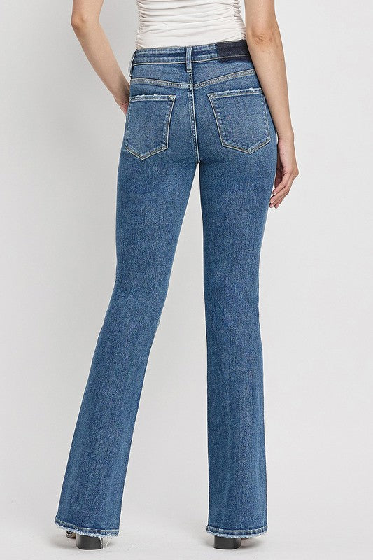 Stylish slant hem flare jeans with high waist and medium wash.
