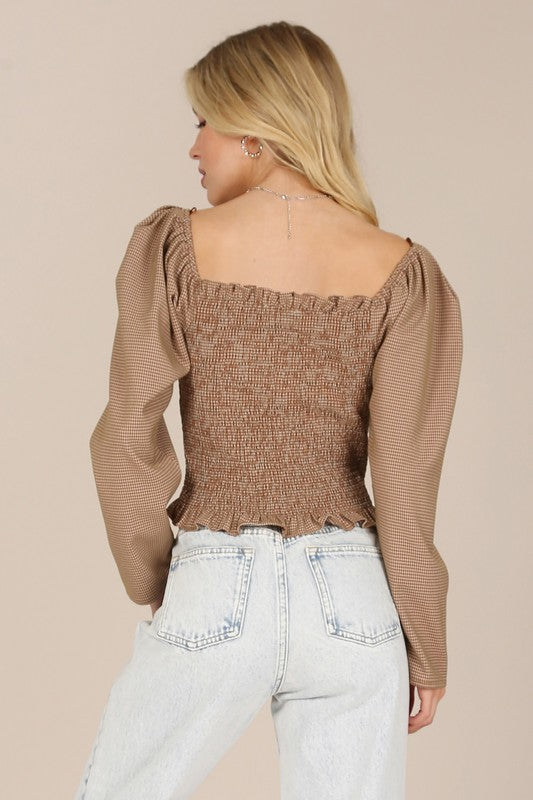 Feminine square neck blouse with long puffed sleeves in brown.
