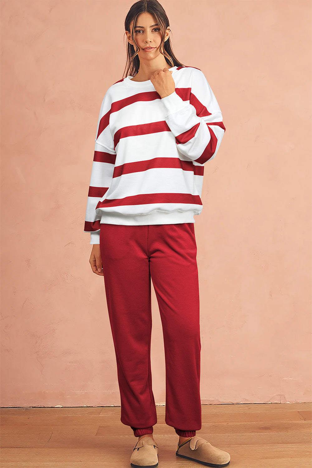 Red drop shoulder pullover and matching joggers for casual wear
