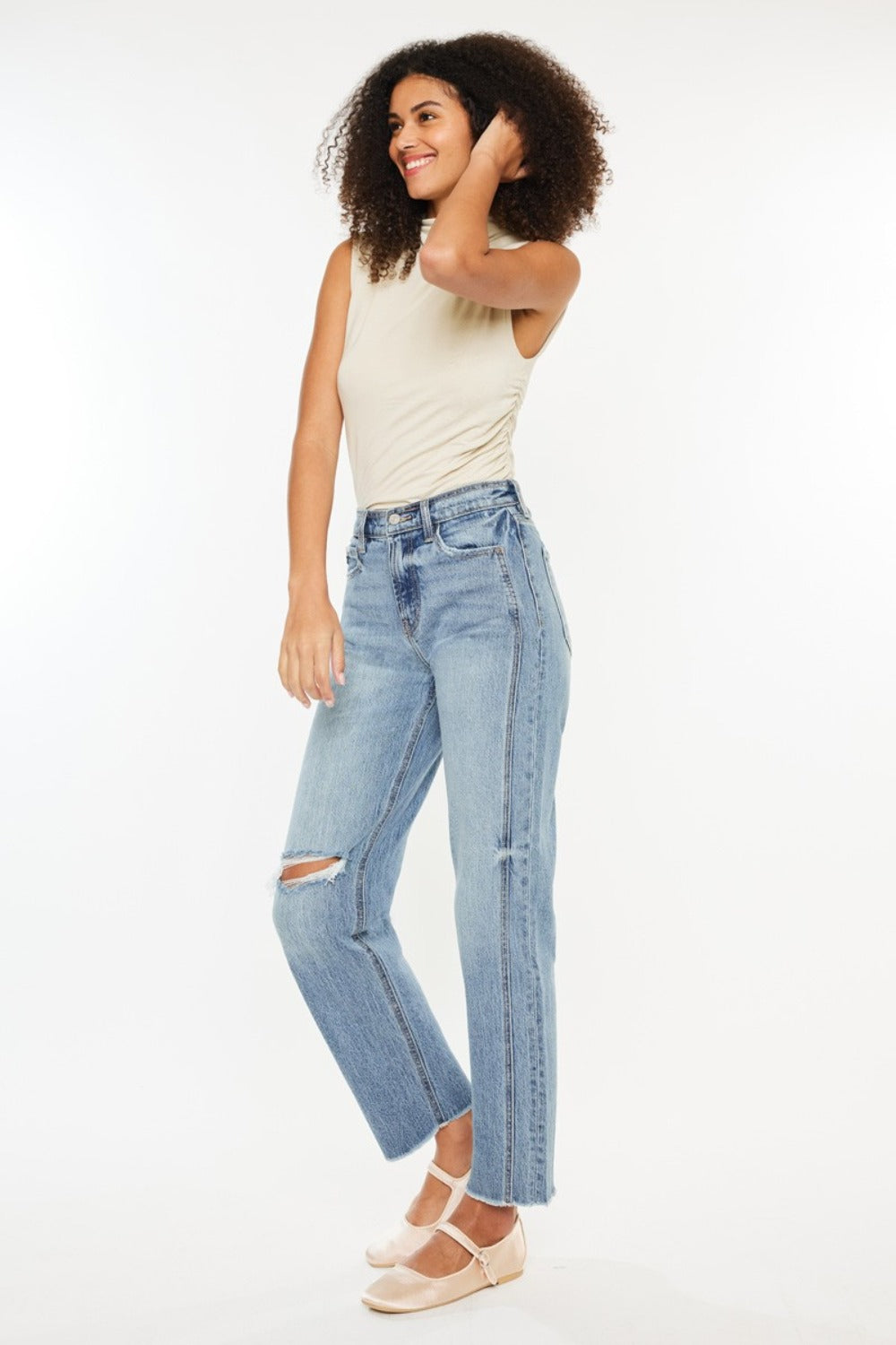 Raw hem detail on Kancan distressed straight-leg jeans for a casual-chic look.
