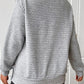 Stylish side-button waffle-knit sweatshirt in gray, relaxed fit.
