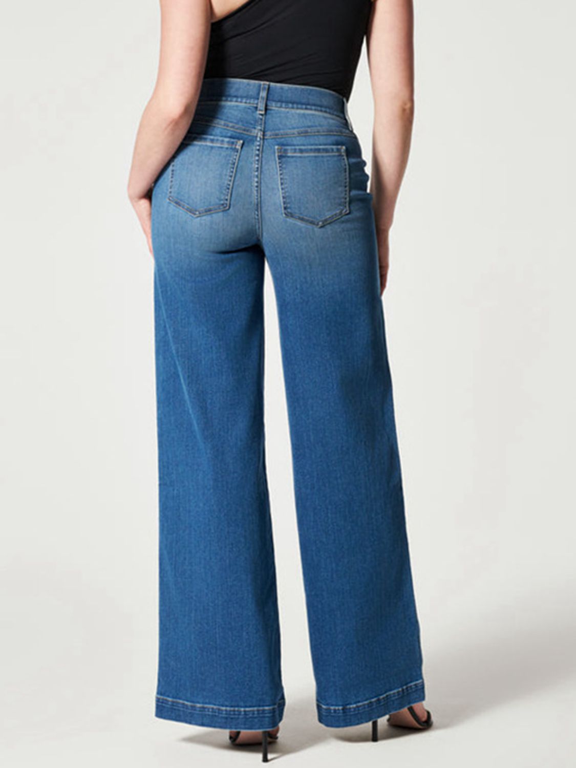 Fashion-forward wide-leg jeans in medium wash with high waist.