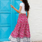 Side profile of a tropical print red boho skirt with graceful flowy movement.
