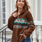 Brown sherpa fleece sweatshirt with Aztec pattern, ideal for casual winter days.
