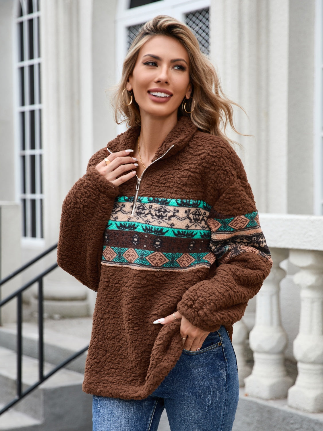 Brown sherpa fleece sweatshirt with Aztec pattern, ideal for casual winter days.
