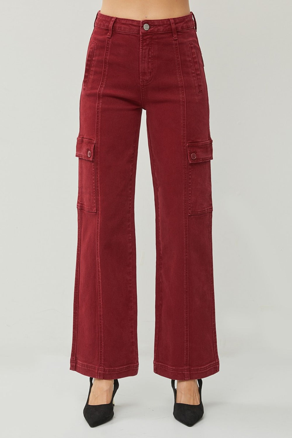 Relaxed fit high-rise wide leg jeans in red, styled casually with heels.
