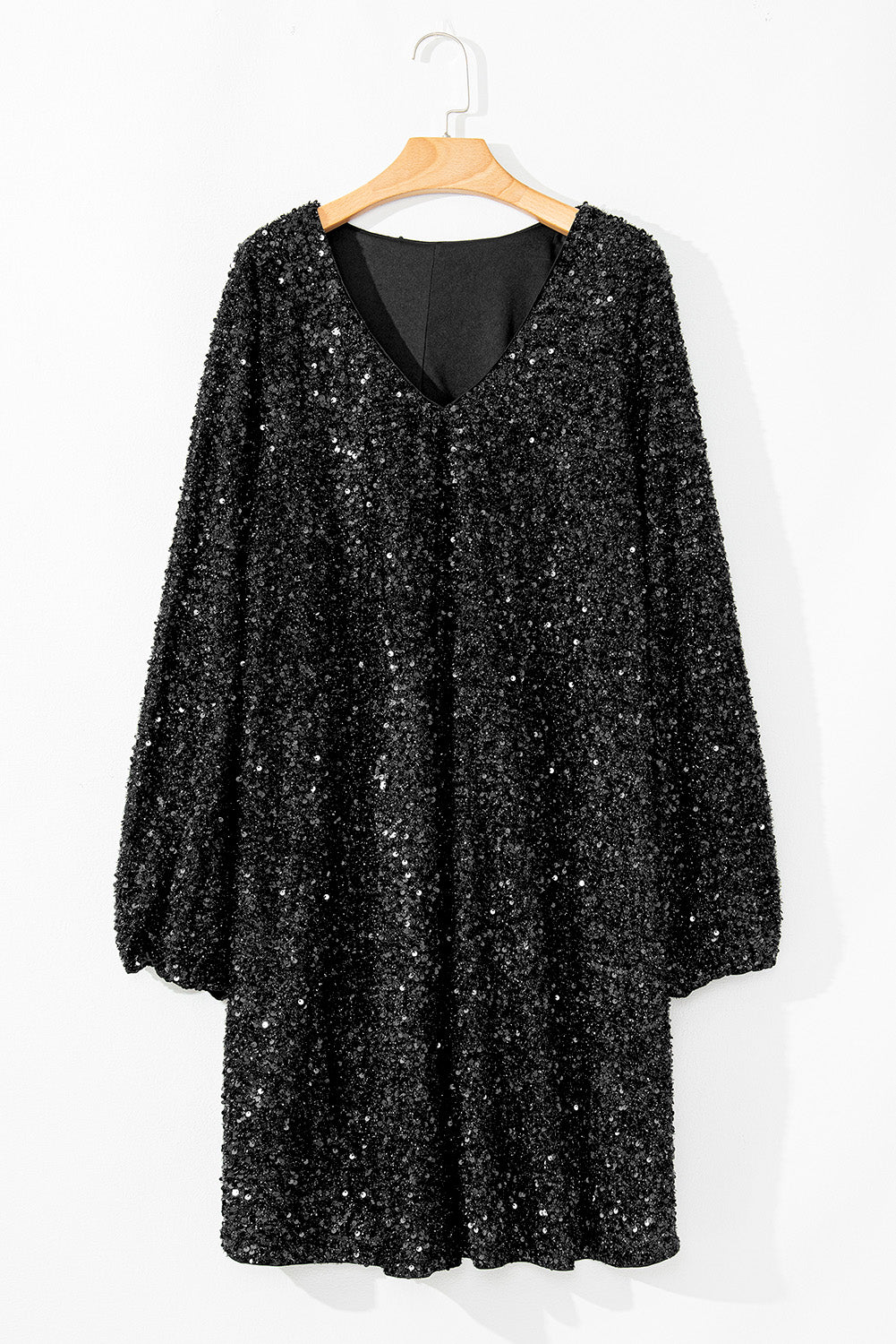 Glamorous plus-size black sequin dress with romantic bubble sleeves