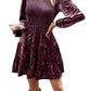 Front view of a velvet tiered dress with puff sleeves and smocked bodice
