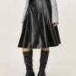 Faux leather skirt in black with a flattering high-waisted design.
