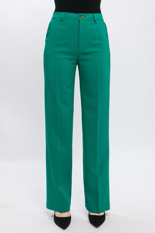 Green formal blazer pants with functional belt loops for styling.
