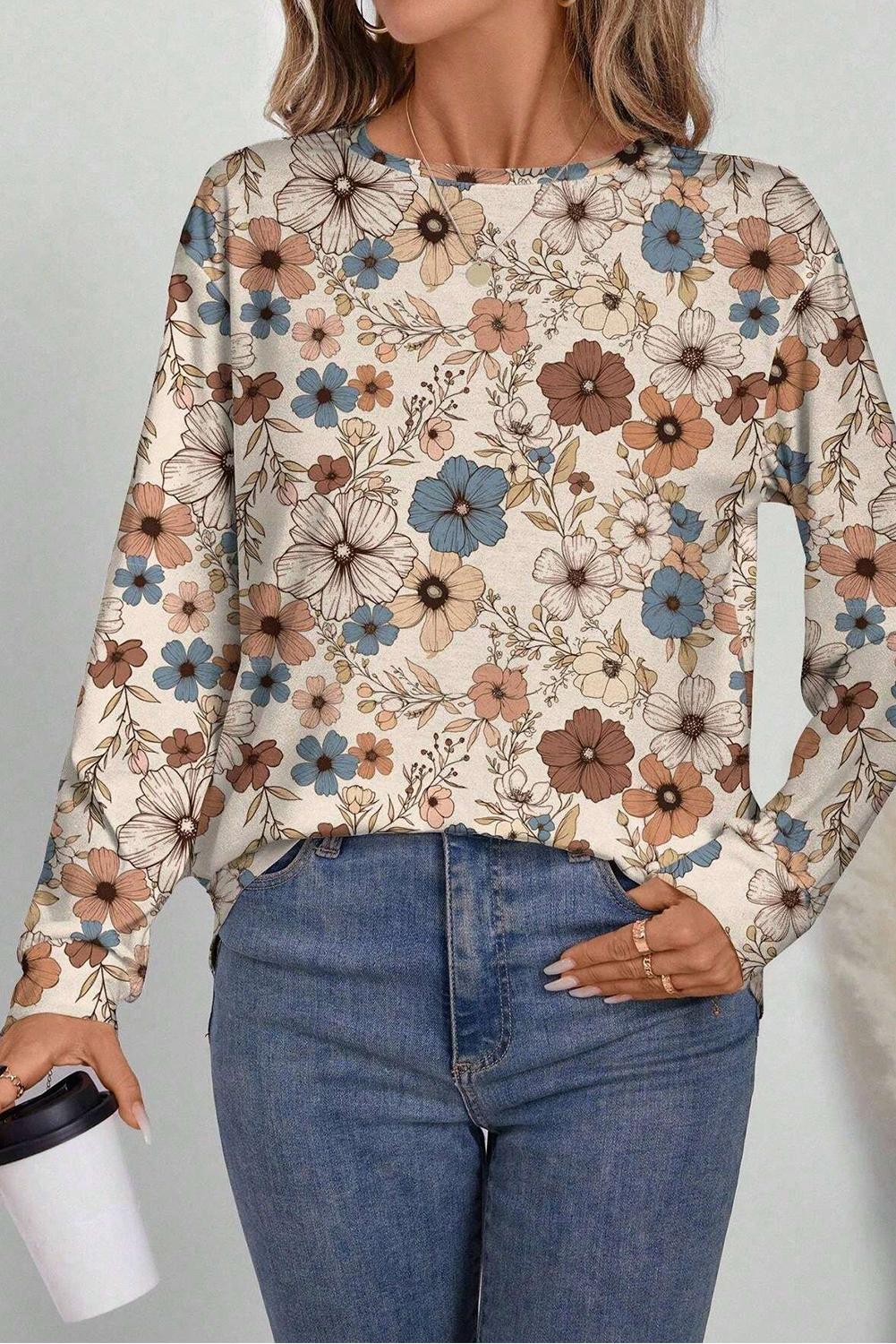 Long-sleeve floral print top styled for casual daytime or evening outings.
