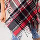 Plaid shawl with fringe, perfect for autumn layering.