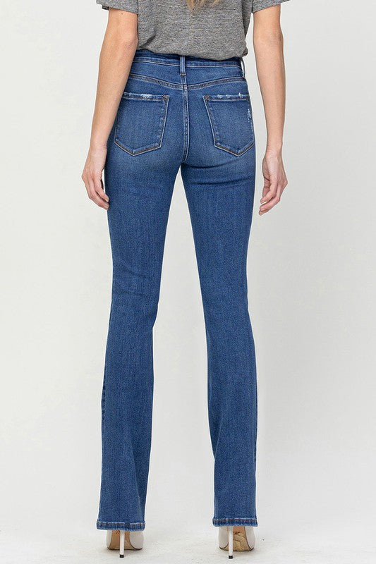 VERVET bootcut jeans showing front and back view, styled with heels.
