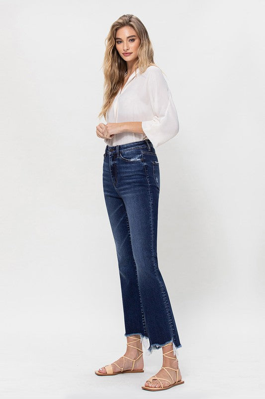 High-rise kick flare jeans with a distressed hem detail, perfect for casual wear.
