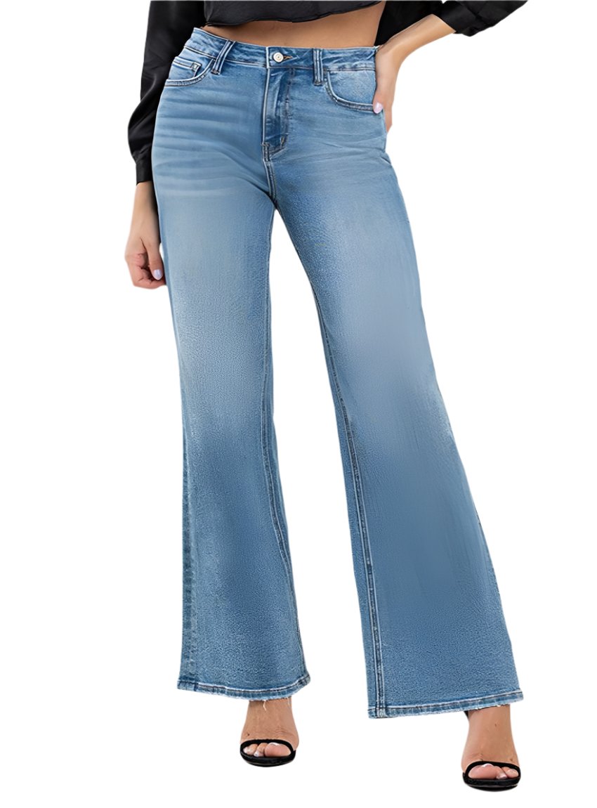 Woman wearing VERVET High Rise Wide Leg Jeans in medium wash
