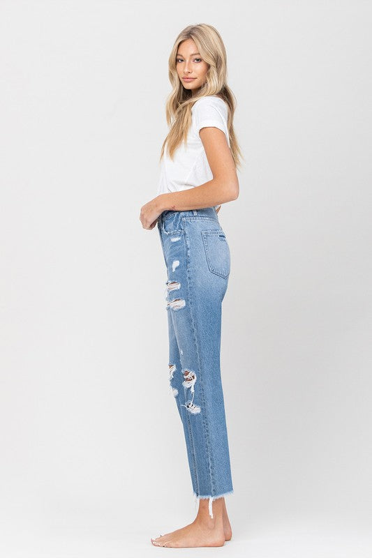 Side view of VERVET raw hem mom jeans with relaxed fit.
