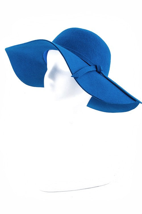 Vibrant blue wool felt hat with a stylish floppy brim for a chic look.
