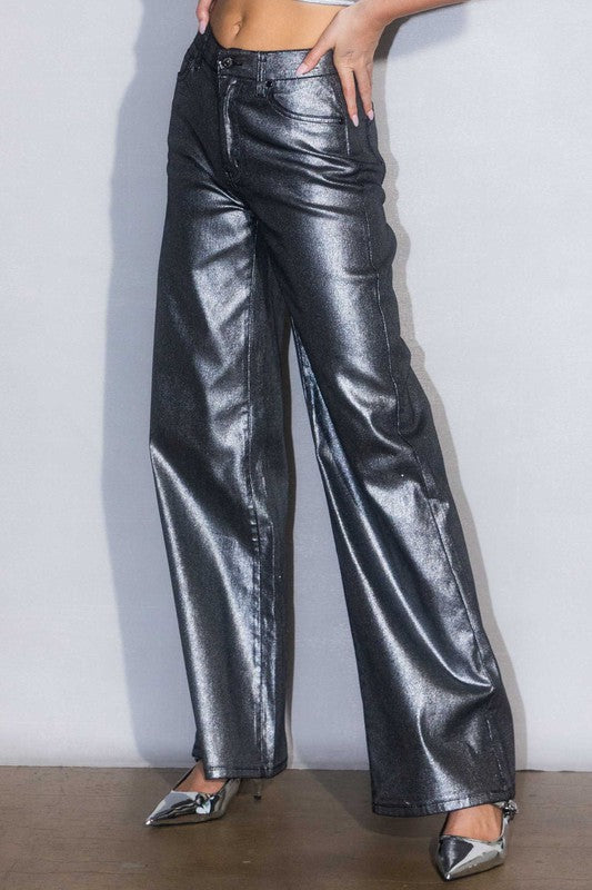 Side view of metallic high-rise jeans highlighting wide-leg silhouette and sleek fit.
