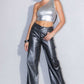 Styled outfit featuring metallic wide-leg jeans paired with metallic heels for a bold statement.
